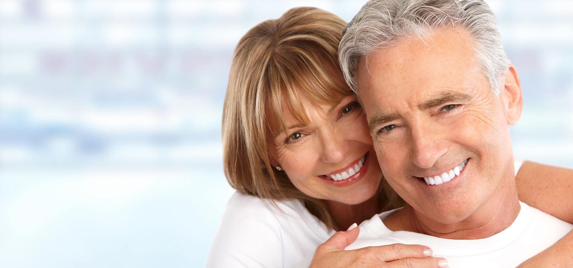 Happy patients with white teeth after cosmetic dentistry at South Tulsa Dental